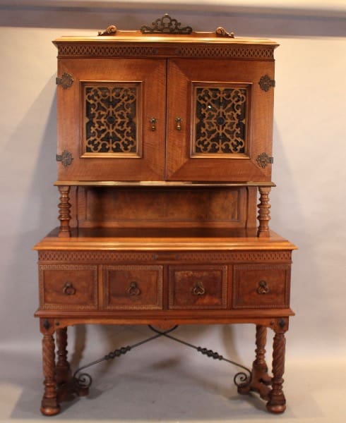 Antique wooden cabinet with ornate carvings.
