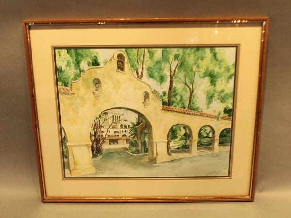 Framed watercolor painting of an arched building.