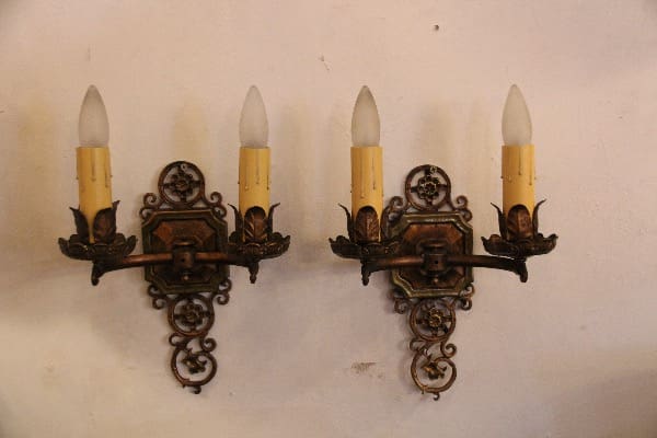 Vintage wall sconces with candle-shaped bulbs.