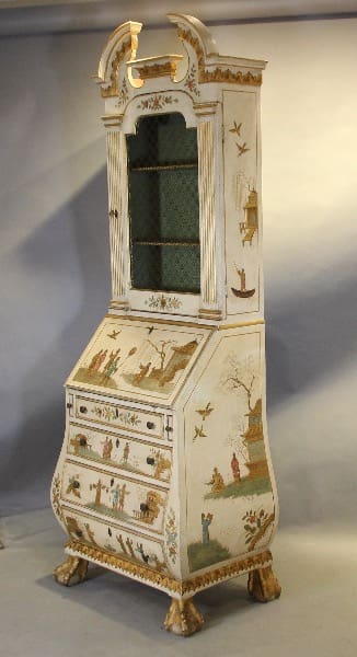 Ornate antique cabinet with painted decorations.