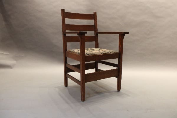Wooden chair with patterned cushioned seat.