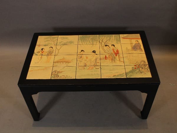 Decorative table with painted tile design.
