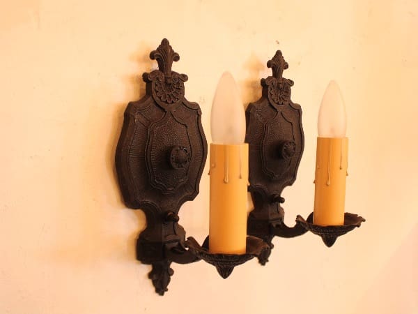 Vintage wall sconce with two candle lights.