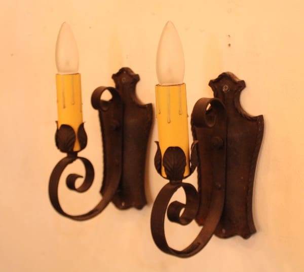 Vintage wall sconce with candle-shaped bulbs.