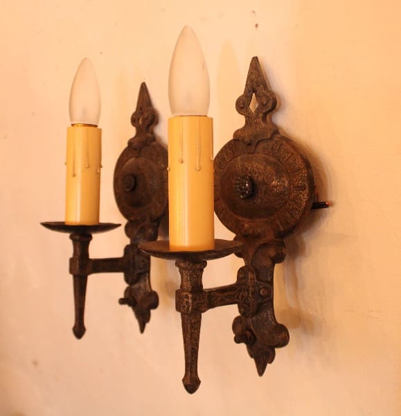 Vintage wall sconces with candle-shaped bulbs.