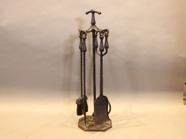Antique fireplace tool set with stand.