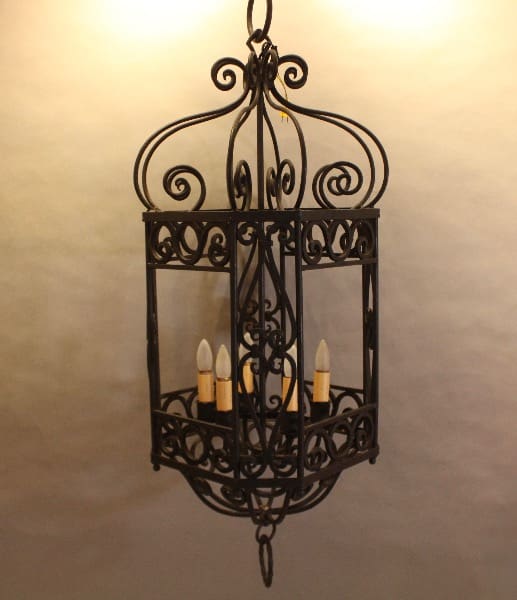 Wrought iron chandelier with candle lights.