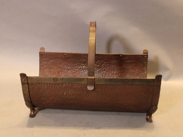 Antique copper and brass firewood holder.