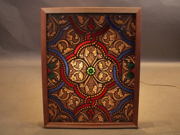 Colorful stained glass panel with intricate patterns.