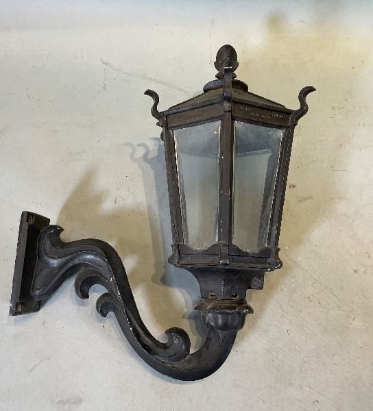 Vintage wrought iron wall-mounted lantern.
