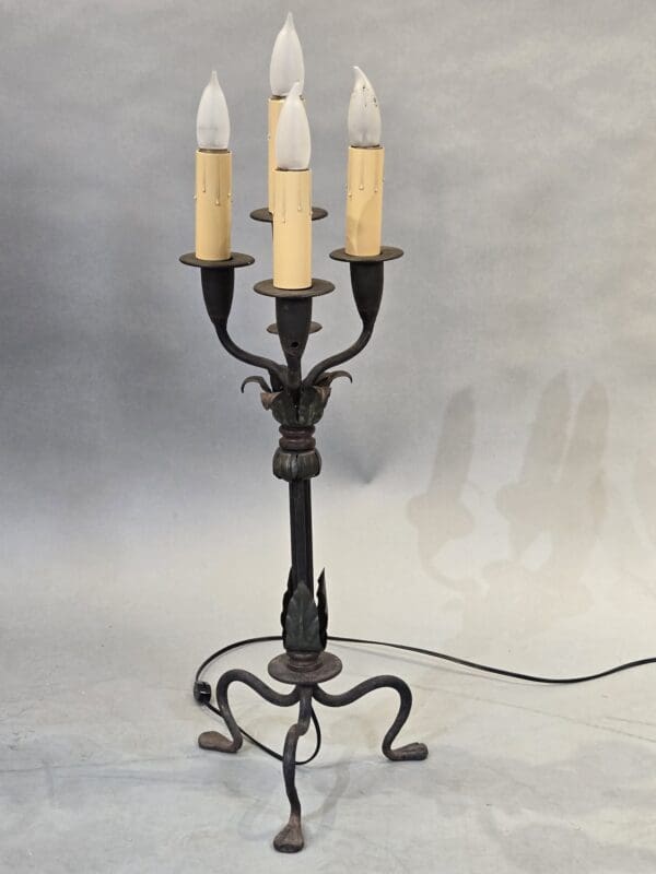 Vintage wrought iron candelabra-style lamp.