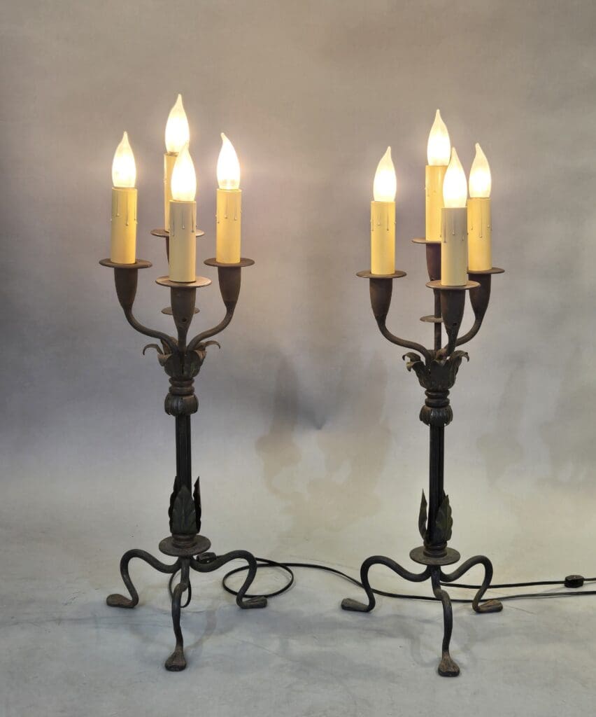 Two vintage candelabra lamps with glowing bulbs.