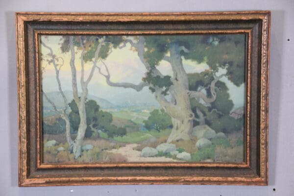 Painting of landscape with trees and mountains.