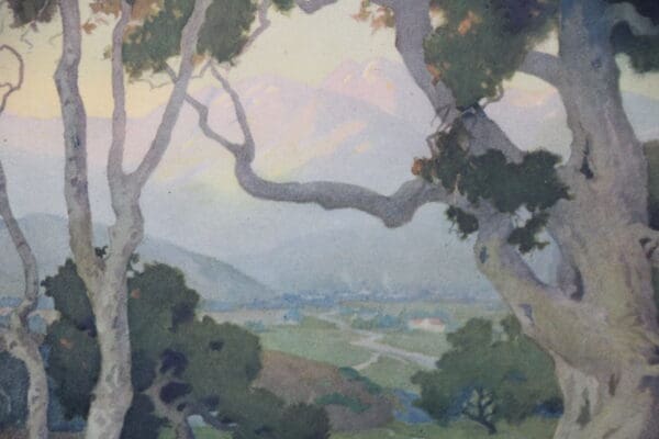 Landscape with trees and distant mountains.