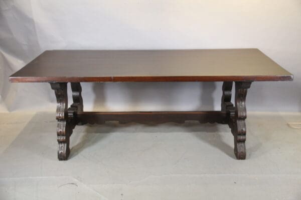 Wooden table with decorative carved legs.
