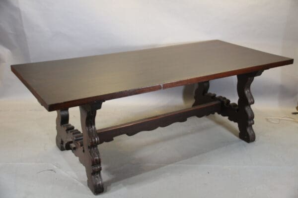 Wooden table with ornate legs.