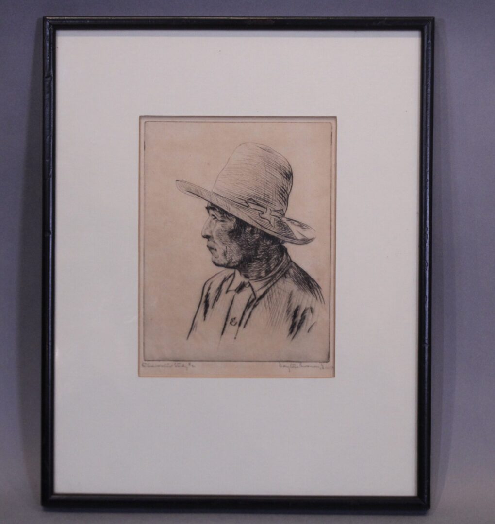 Framed sketch of person wearing hat.