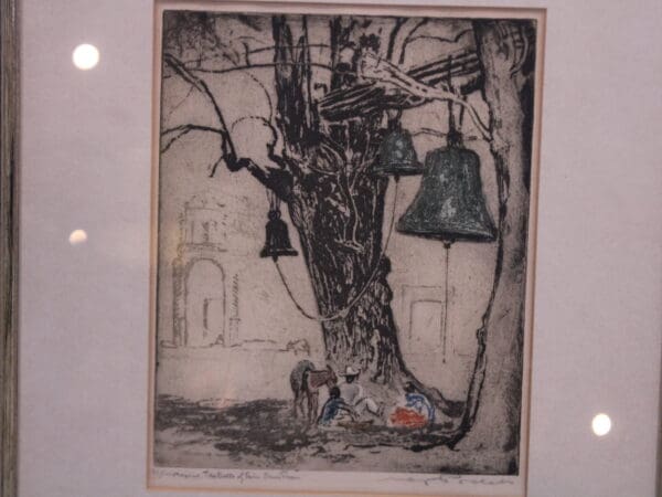 Etching of tree with hanging bells.