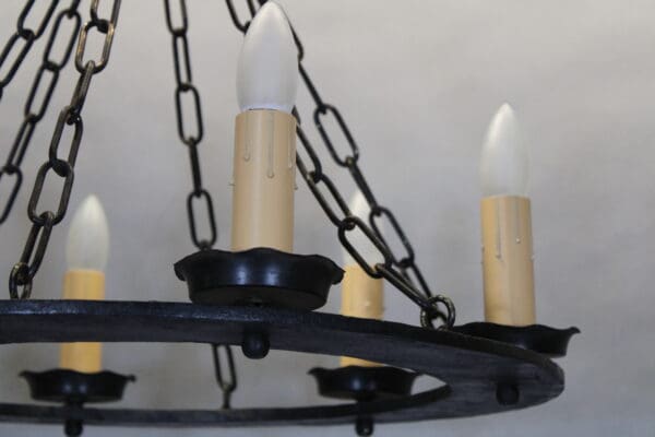Rustic chandelier with candle-like bulbs.