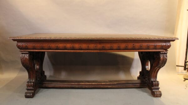 Ornate wooden table with carved legs.