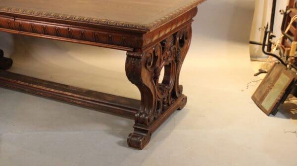 Ornate wooden table with carved legs.