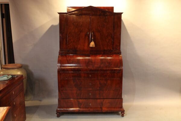 Antique wooden cabinet with multiple drawers.
