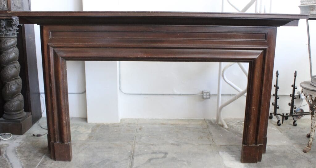 Wooden table with ornate legs and carvings.