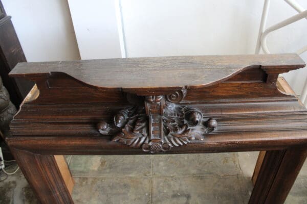 Ornate wooden furniture piece with carved design.