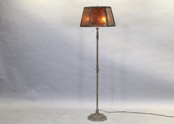 Vintage floor lamp with brown lampshade.