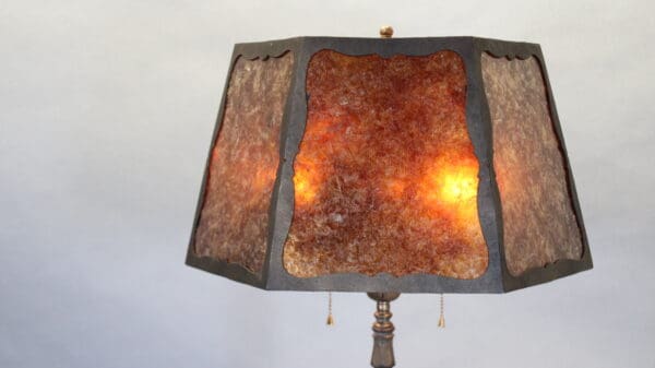 Vintage lamp with brown textured lampshade.