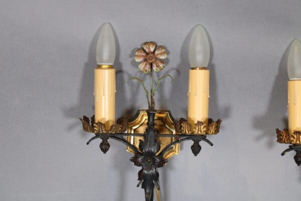 Ornate vintage wall sconce with bulbs.