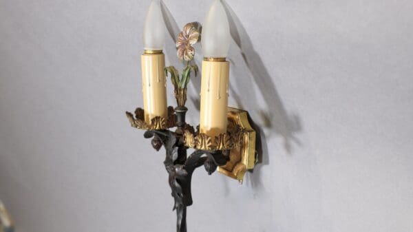 Vintage wall sconce with two candle bulbs.