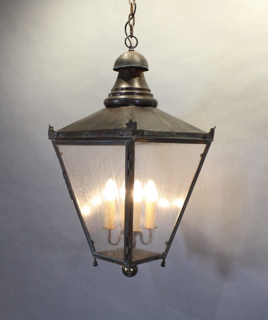 Vintage hanging lantern with glowing bulbs.