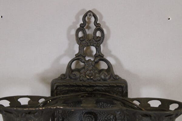 Ornate vintage cast iron wall bracket.