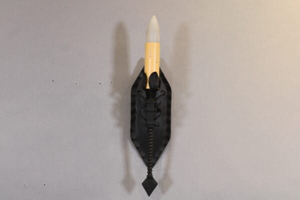 Decorative wall-mounted sculpture with rocket design.