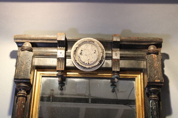 Ornate vintage mirror with carved wooden frame.