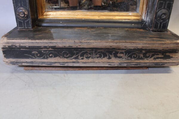 Antique wooden frame with ornate detailing.