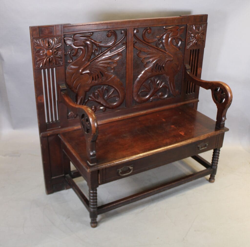 Wooden bench with carved dragon design.