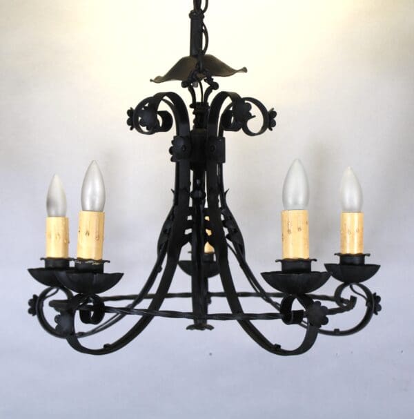 Black wrought iron chandelier with candles.