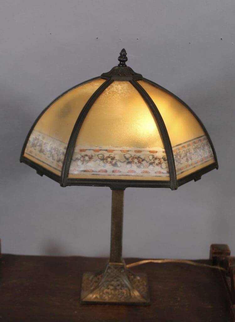 Vintage table lamp with decorative shade.