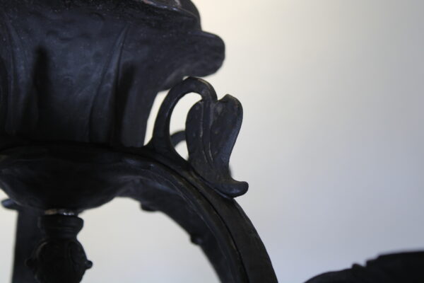 Close-up of ornate black metal sculpture.