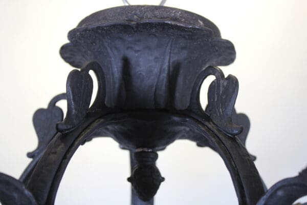 Close-up of ornate black metal chandelier.