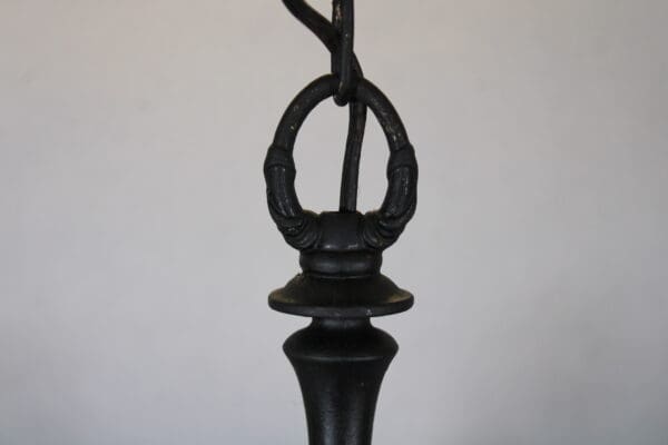 Black metal hanging pendant detail.