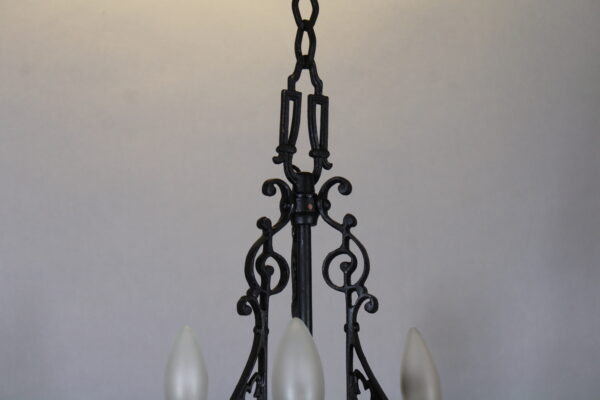 Elegant black wrought iron chandelier fixture.