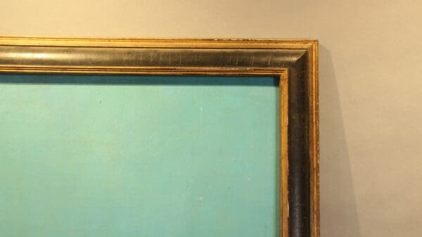 Painting with blue canvas and wooden frame.