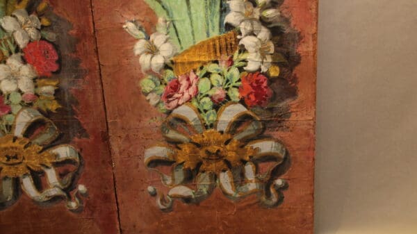 Floral painting with intricate floral arrangement.