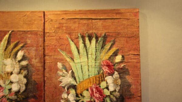Floral painting on textured wooden background.
