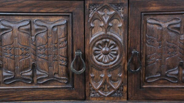 Ornate wooden cabinet with carved details.