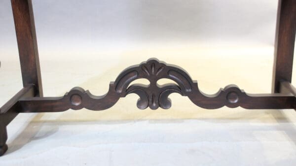 Ornate wooden furniture with decorative carving.