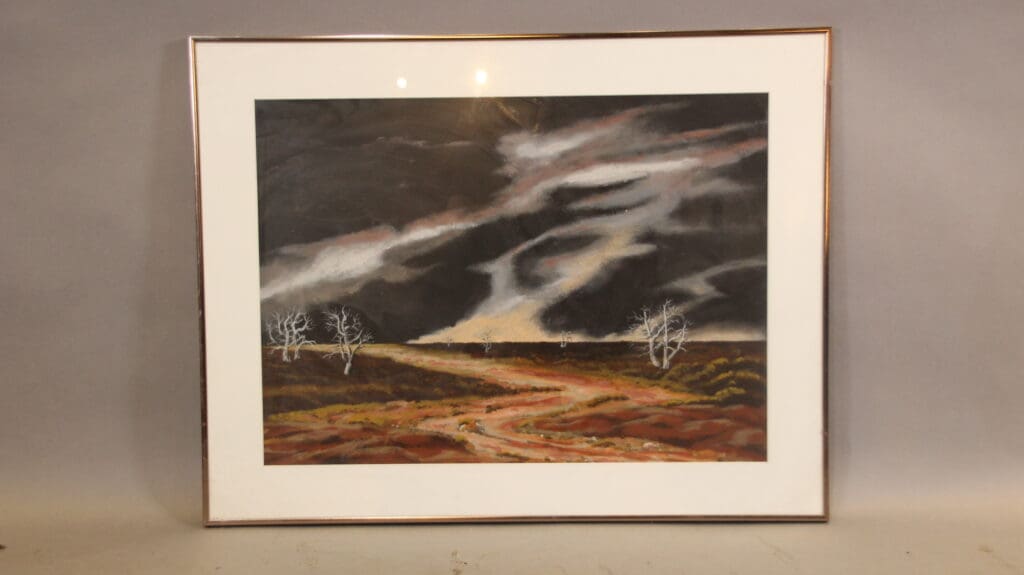 Framed landscape painting with dramatic sky.